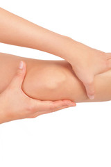 Female knee isolated on white.