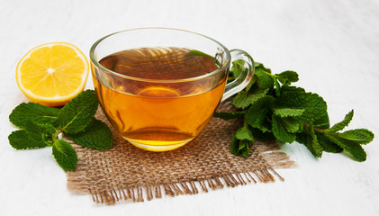 Cup of tea with lemon and mint