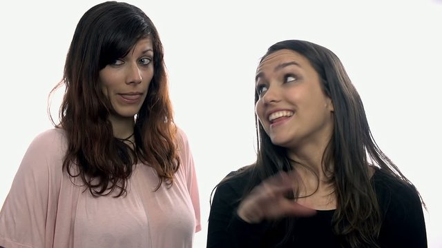 Two girls talking each other on white background