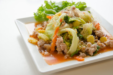 Spicy pork salad on white plate
