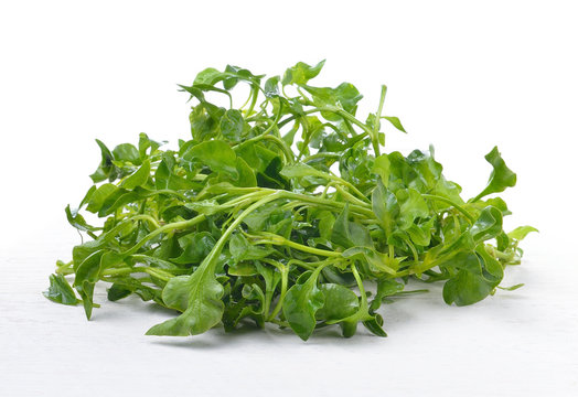 Fresh Watercress on white wooden