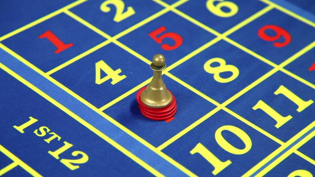 Detail of betting at number seven at roulette table in casino