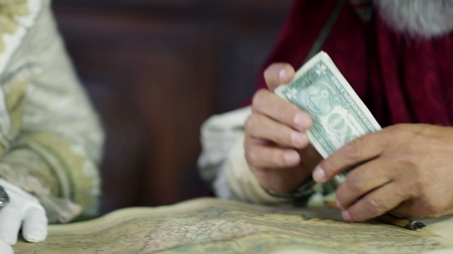 Scholar counting the bank notes