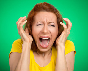 Headshot angry woman screaming hysterical green background 
