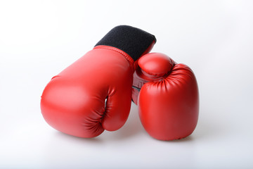 Pair of red leather boxing gloves isolated on white