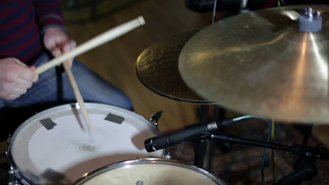 close up shot of musican playing drums