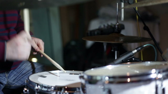 close up shot of musican playing drums