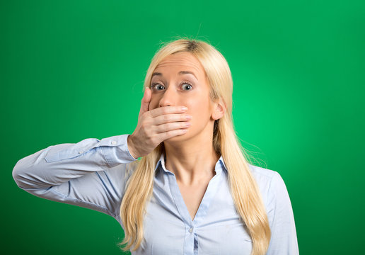 Shocked woman forced to cover her mouth with hand
