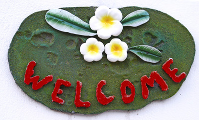 Welcome sign on the white background wall