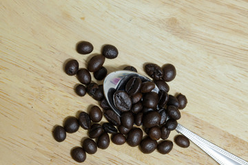 Coffee bean on wooden background.