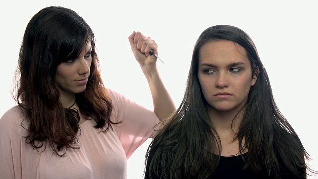 Woman trying to stab friend, she acts shocked