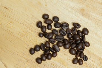 Coffee bean on wooden background.