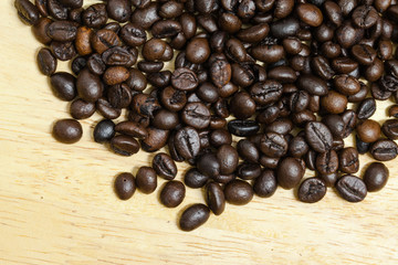 Coffee bean on wooden background.