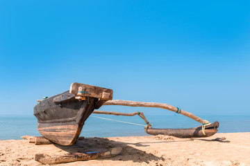 old wooden fishing boat on the beach of a tropical beach