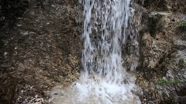 Close up of the small water fall in the forest