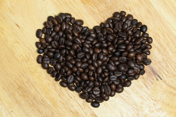 Coffee bean on wooden background.