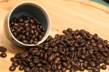 Coffee bean on wooden background.