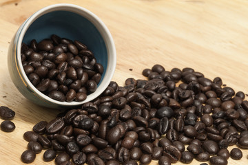 Coffee bean on wooden background.