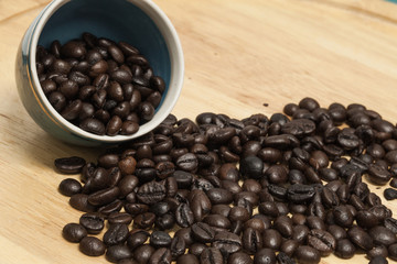 Coffee bean on wooden background.