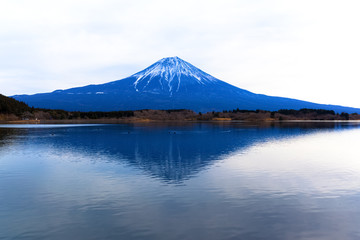 Inverted Mount Fuji reflected in Lake Tanukiko