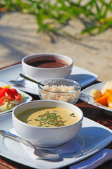 cream soup served with fresh vegetables and fruits