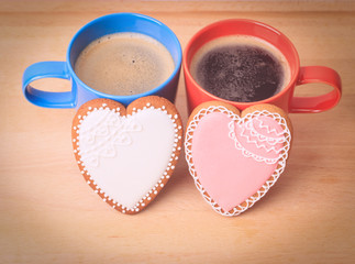 Fototapeta na wymiar two coffee cups and heart cookies