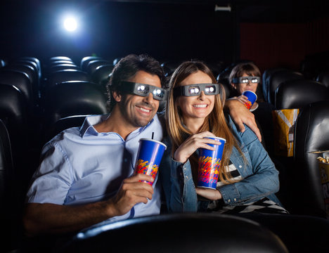 Happy Couple Watching 3D Movie In Theater