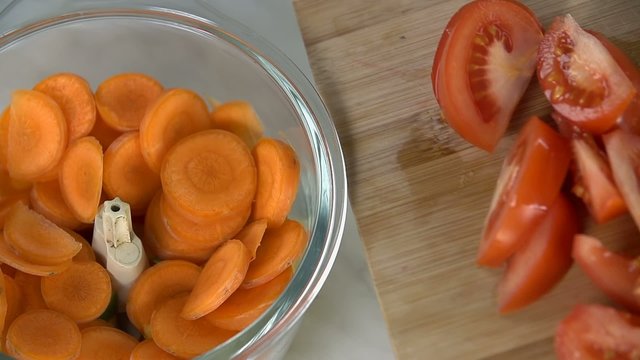 Putting pieces of tomato into blender