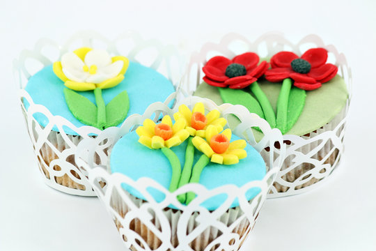 sweet muffins with spring flowers decoration