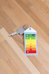Home key with energy label on wood