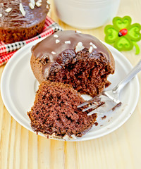 Cupcake chocolate with fork on board