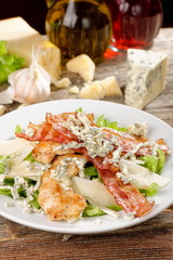 Bowl of Traditional Caesar Salad with Chicken and Bacon