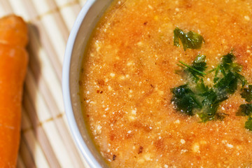Tomato soup with cheese, carrot and onion