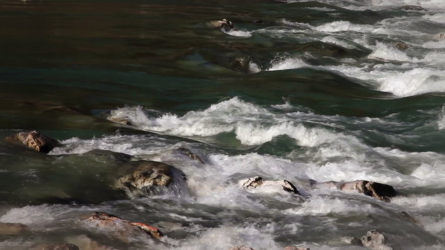 Shot of river rapis across rocks
