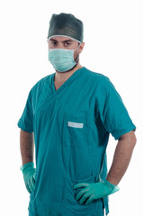 Young surgeon with mask and gloves