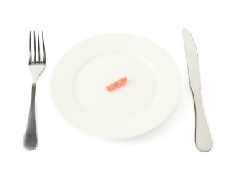 Licorice candy in a plate isolated