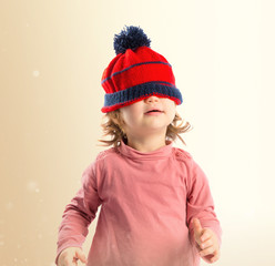 Little girl with Christmas hat over white background