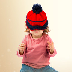 Little girl with Christmas hat over white background