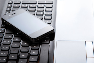 Smartphone on laptop