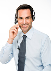 smiling man with headset working as a call center operator