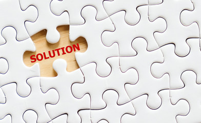 Solution word on jigsaw puzzle, business concept