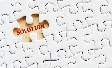 Fototapeta premium Solution word on jigsaw puzzle, business concept
