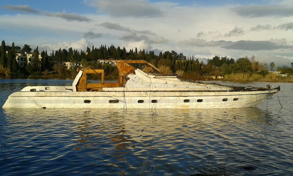 Shipwrecked abandoned motor boat