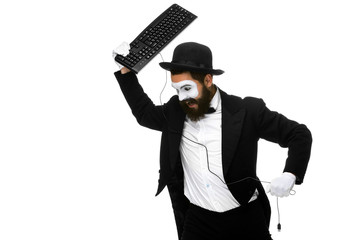 Angry mime as a businessman is destroying  keyboard