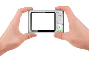 Hand holding a compact digital camera with empty LCD screen