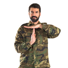 Soldier making time out gesture