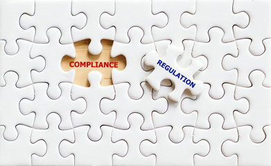 Compliance and Regulation words puzzle piece,business concept