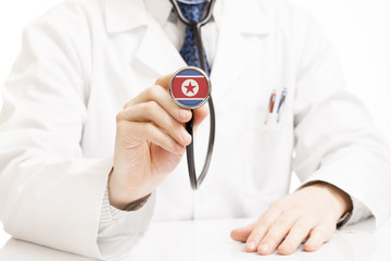 Doctor holding stethoscope with flag series - North Korea