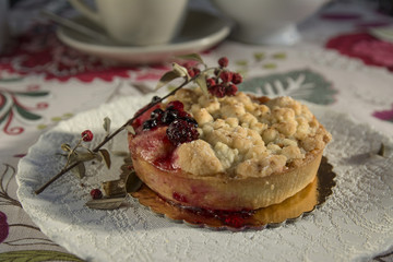 Delicious homemade cherry pie on floral tablecloth
