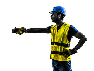 construction worker signaling with flashlight silhouette